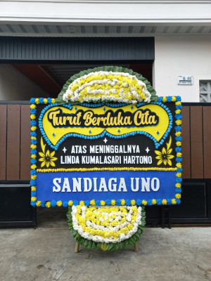Papan Bunga Duka di Pardamean